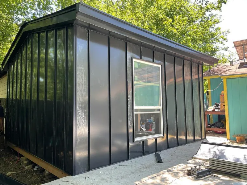 Black standing seam metal wall panels for Roof Inspection in Fish Hawk